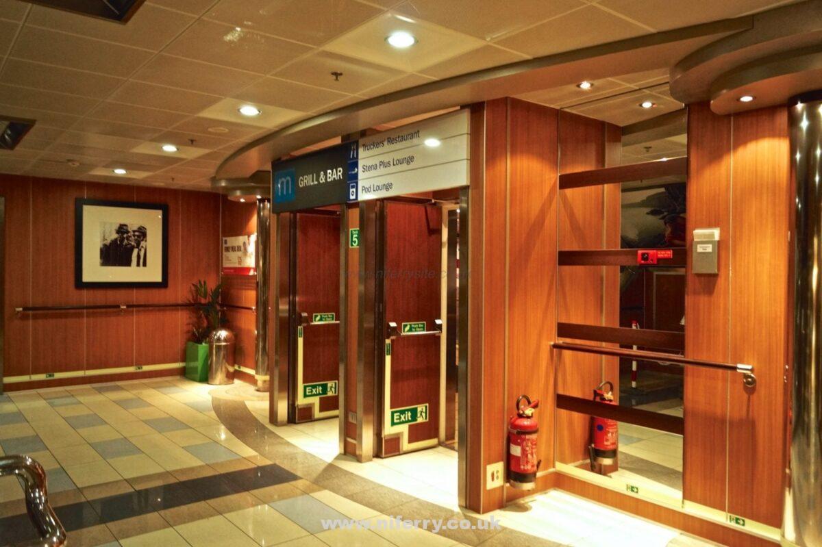 The 2 main walkways through Barista merge here in-front of the staircase to the main cabin deck. These double doors lead to the pod lounge, Stena Plus, and then the Met Bar and Grill, as well as the truckers restaurant. © NIFerrySite