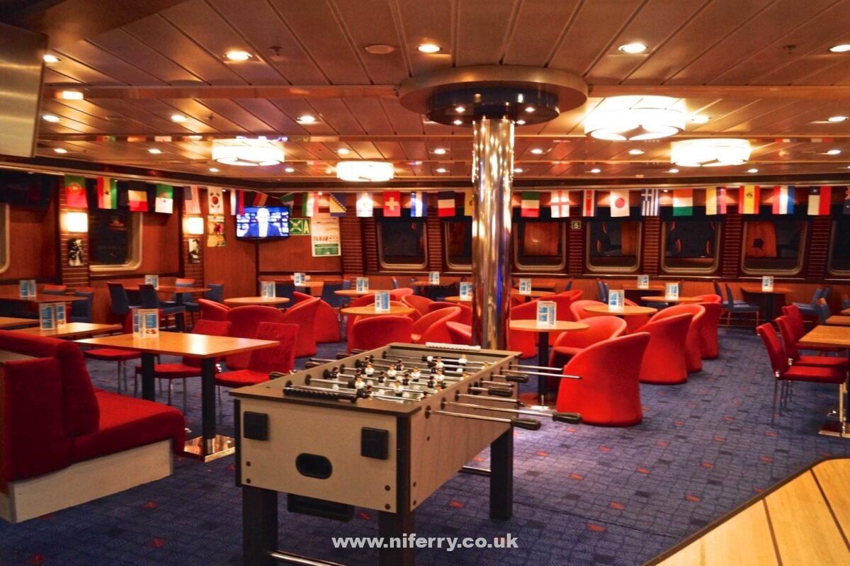 The forward seating area of the Met Bar and Grill. The Fussball table and flags are present for the Fifa World Cup 2014. © NIFerrySite