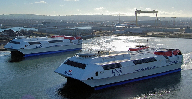 HSS Explorer passing HSS Voyager, which is at Harland and Wolff's ship repair quay. Stena Discovery is just just visible under the massive yellow "samson" crane in the background. Copyright © Alan Geddes.