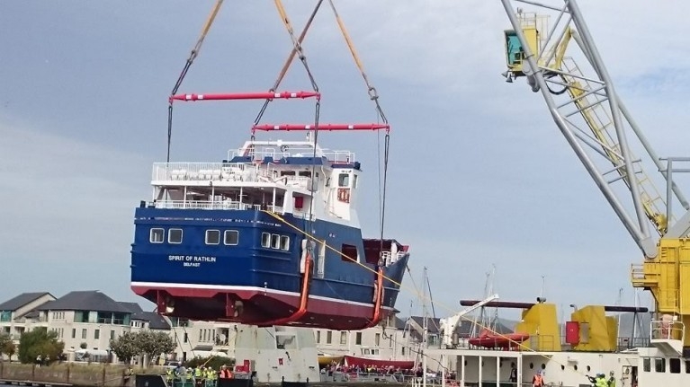 Spirit of Rathlin in mid-air during her 'launch' by the crane barge Lara I. Courtesy of Arklow Marine Services.