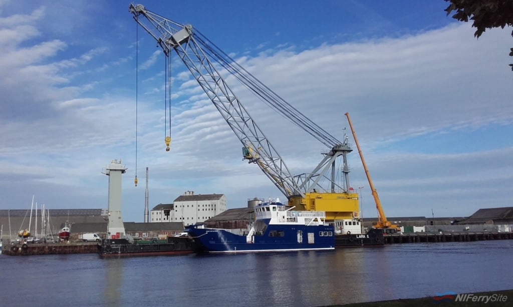 Spirit of Rathlin rests in the River Avoca following her 'launch' by the crane barge Lara I. Courtesy of Arklow Marine Services.