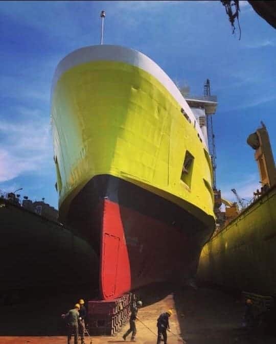 IBN BATOUTA in drydock at the Gemak Shipyard, Tuzla, Turkey in early April 2018. She has recentlly had her hull repainted in a new yellow scheme. Polimar Shipping.