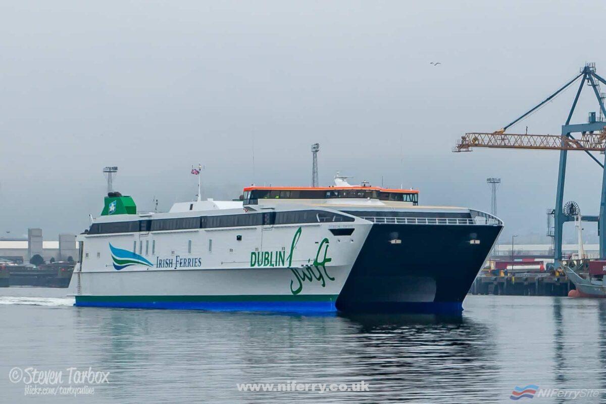 Irish Ferries' Austal AutoExpress catamaran DUBLIN SWIFT passes Beflast's Victoria Terminal 3 container terminal as she leaves Belfast for Dublin. This followed the conclusion of a comprehensive 3-month long refit and conversion project at Belfast's Harland & Wolff Shipyard