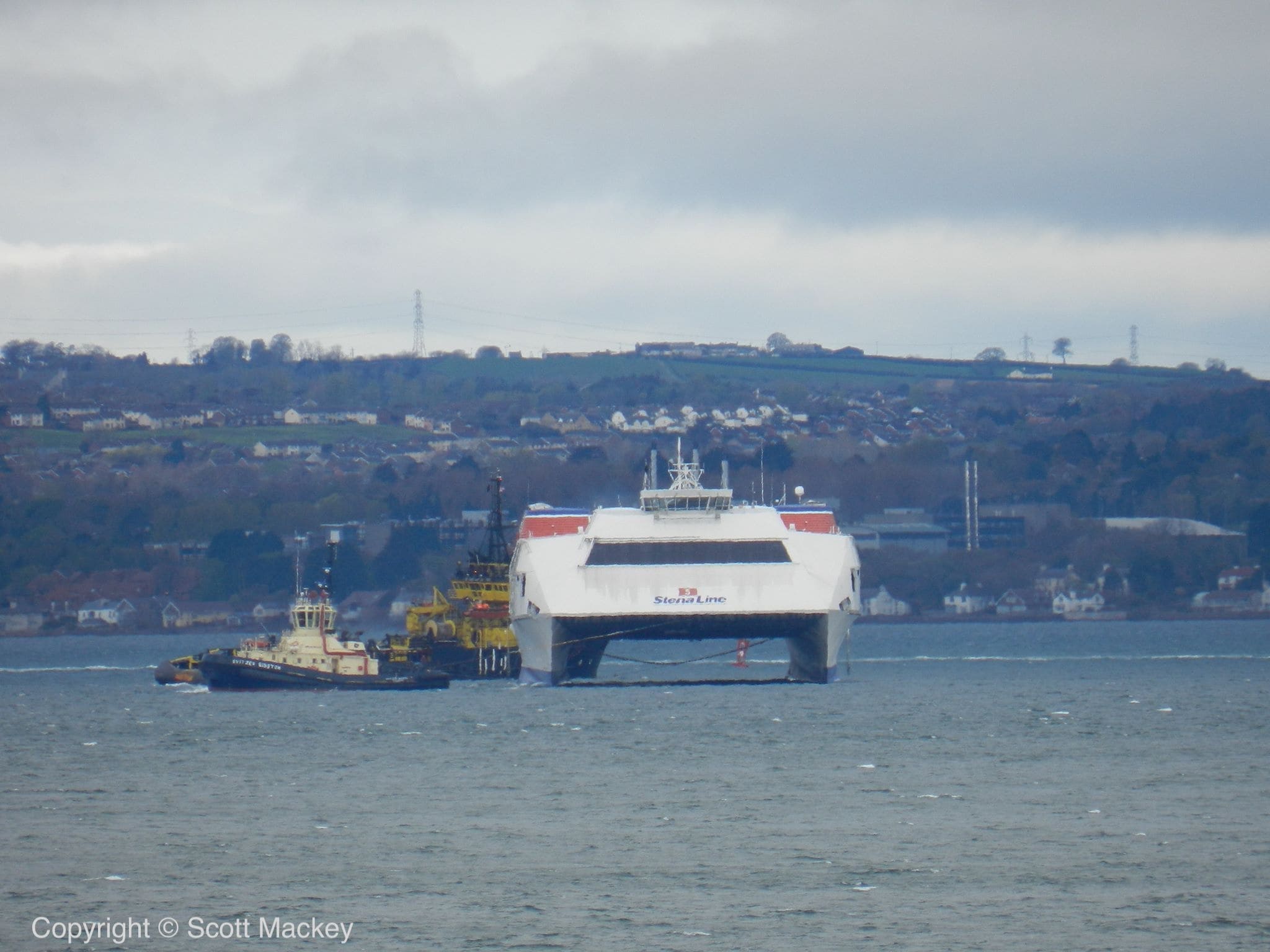 HSS STENA VOYAGER being towed from Belfast by the tug AGAT. Copyright © Scott Mackey.