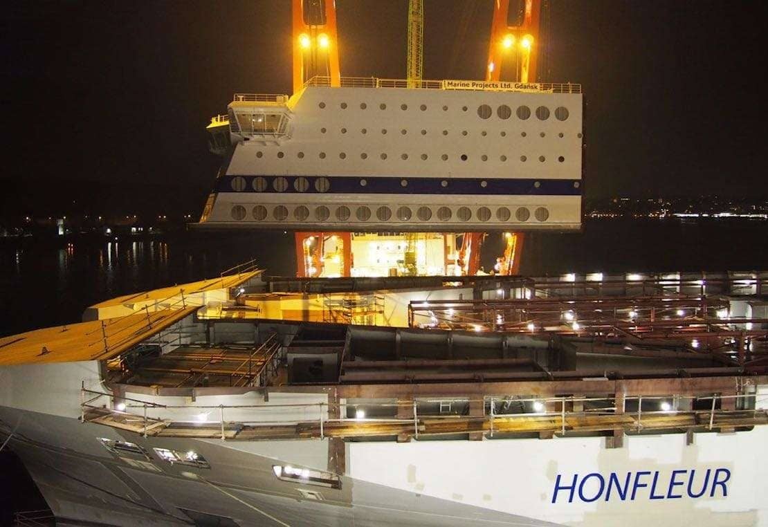 The forward superstructure block is lifted on to Brittany Ferries HONFLEUR at Germany's FSG. Brittany Ferries.
