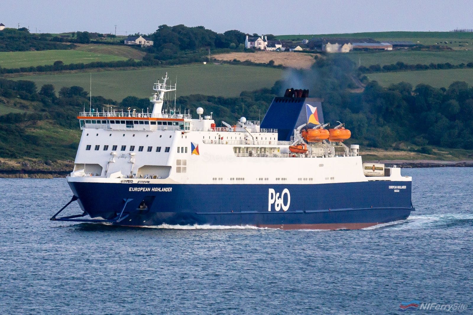 P&O Ferries EUROPEAN HIGHLANDER makes her way past Loch Ryan Port towards Cairnryan on her 04:00 sailing from Larne, 03.08.19. Copyright © Steven Tarbox.