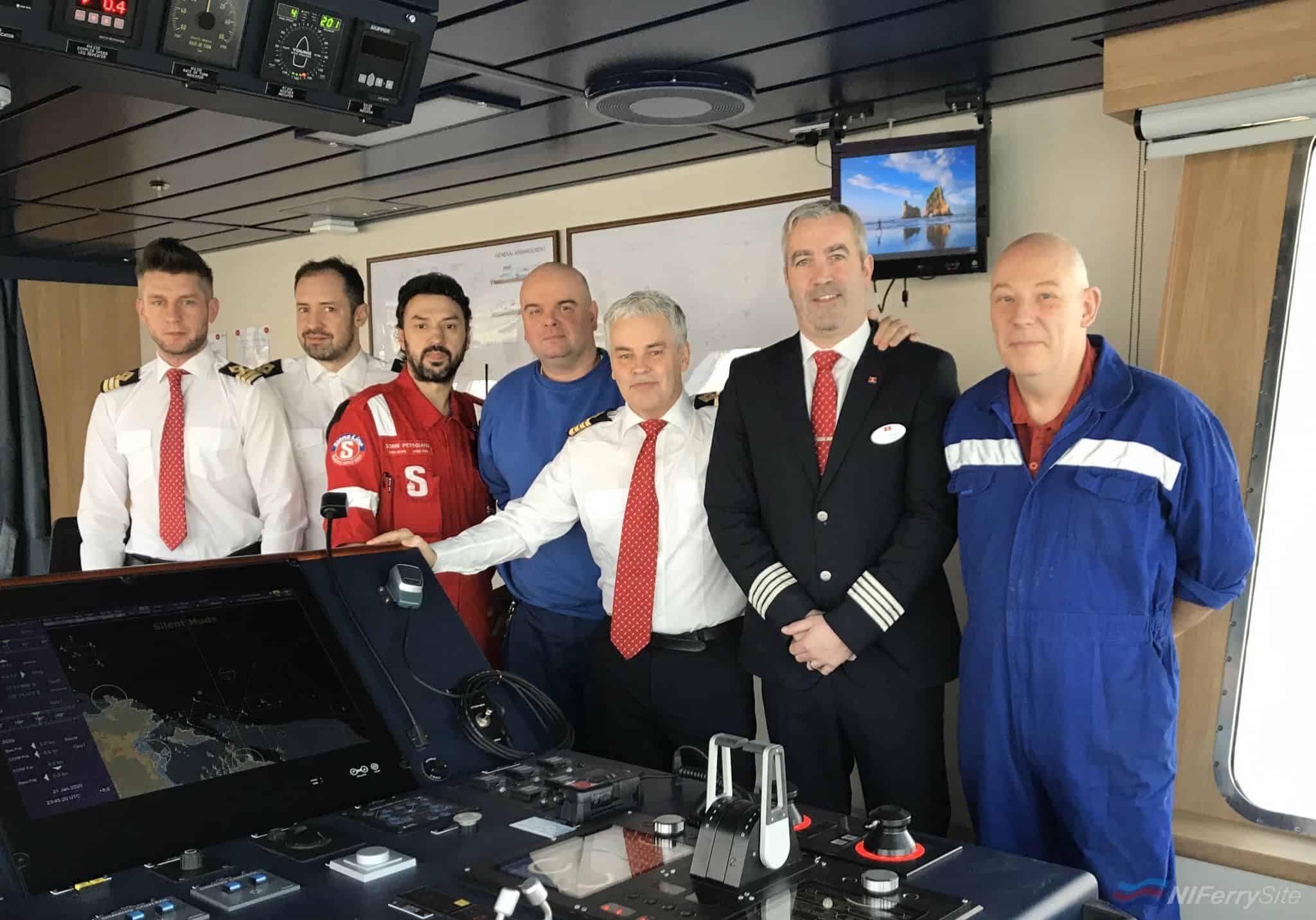 Some of STENA EDDA's delivery crew join Senior Master Captain Neil Whittaker (white shirt, centre) on the bridge to mark the start of her delivery voyage to the UK. Stena Line.